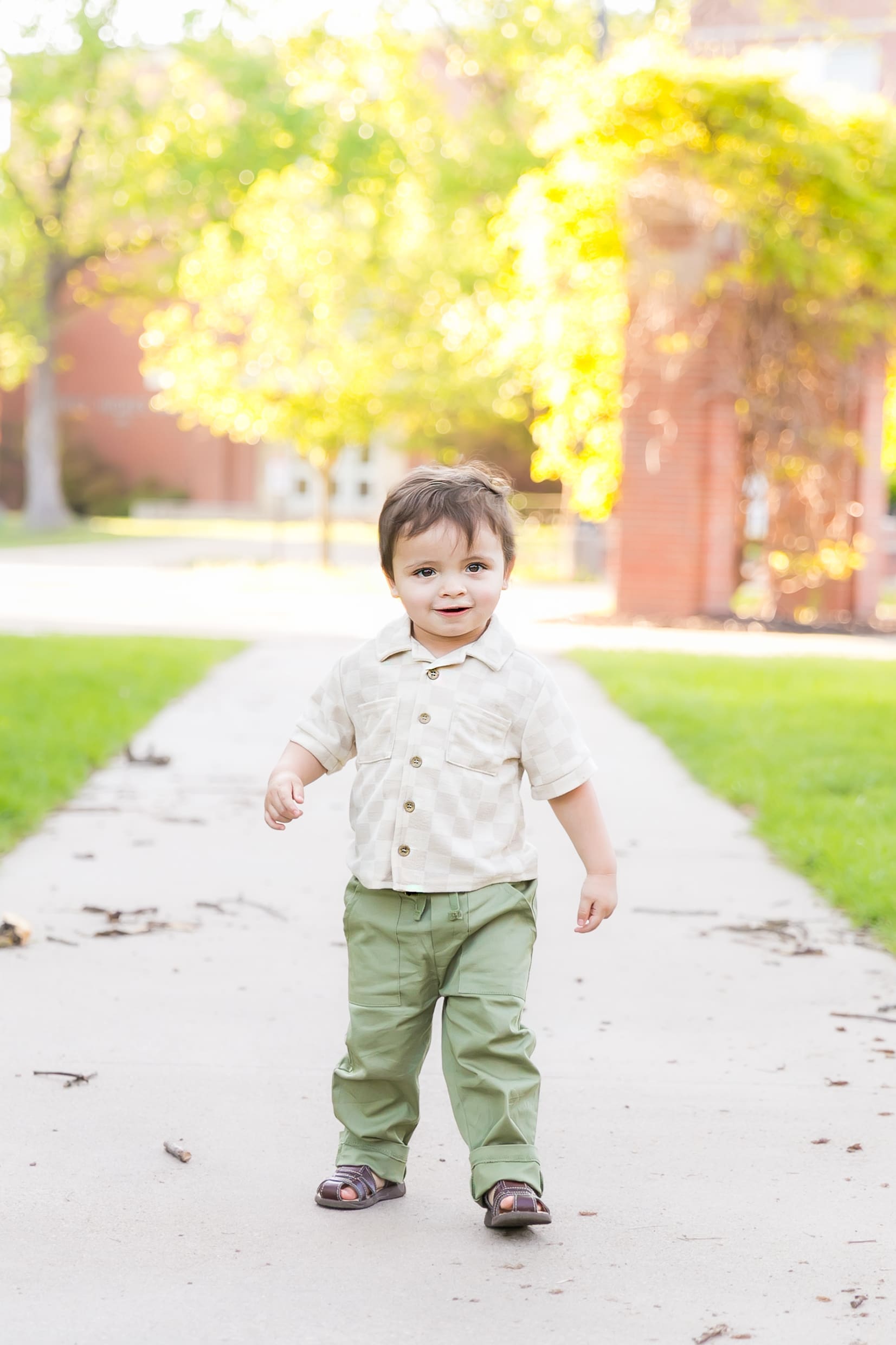 Candid toddler milestone photography at Pitt State University