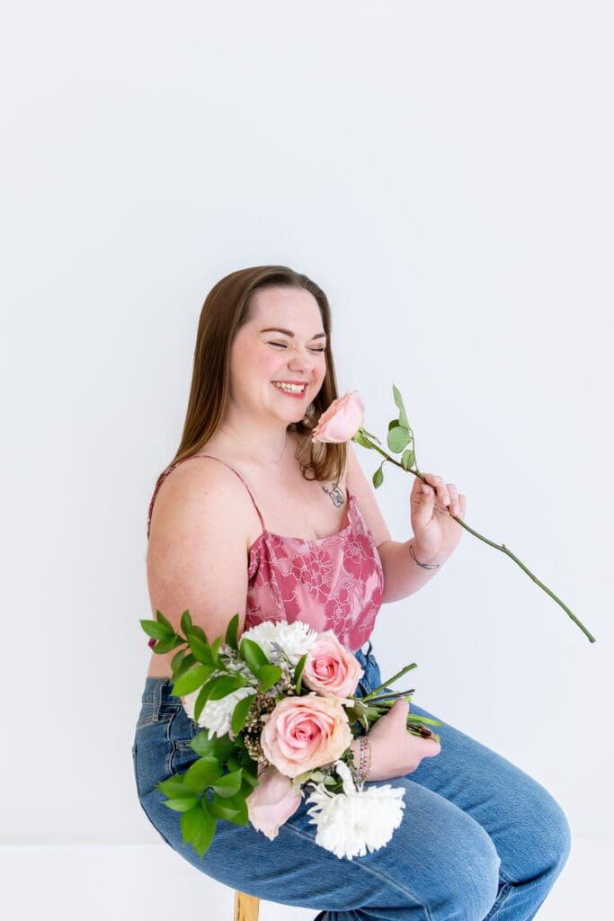 Small business owner with increased confidence cheesing during brand photoshoot in joplin mo