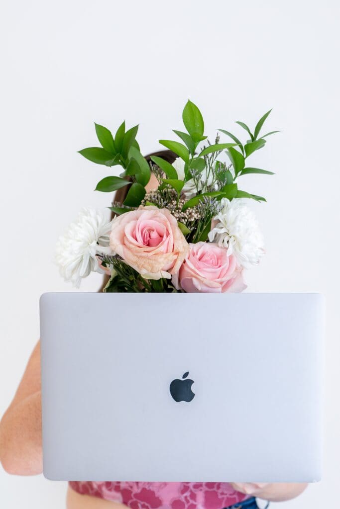 strategic imagery for small business coach with laptop during brand photo session in joplin mo