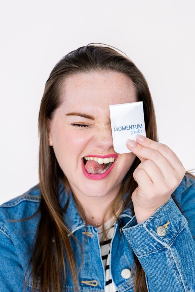 Small business owner with increased confidence making silly face during brand photoshoot in joplin mo